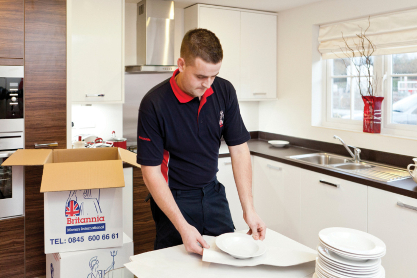 Man Packing Away Plates