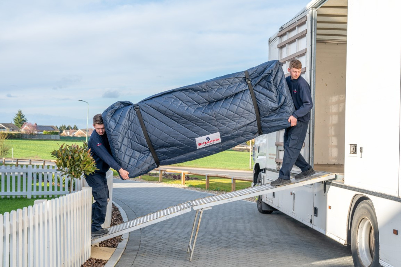 Carrying sofa into truck (1)