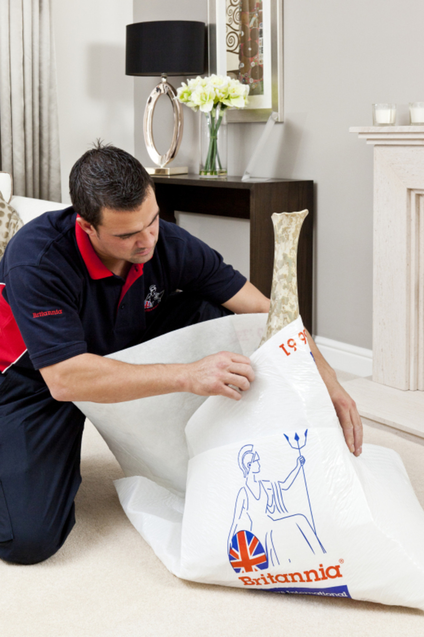 Man Packing Away Item in a House